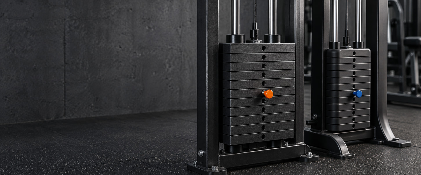 Two gym-machine weight stacks with orange and blue selector pins and chrome guide rods.