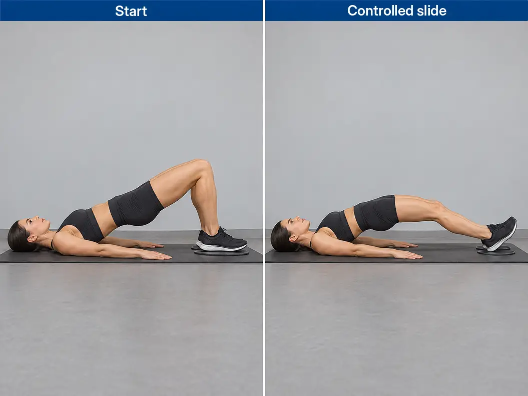 Sliding leg curl with both heels on exercise sliders, showing a bent-knee bridge and a controlled outward slide with the hips raised.